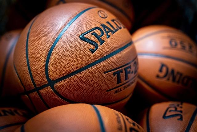 A close-up of several basketballs.