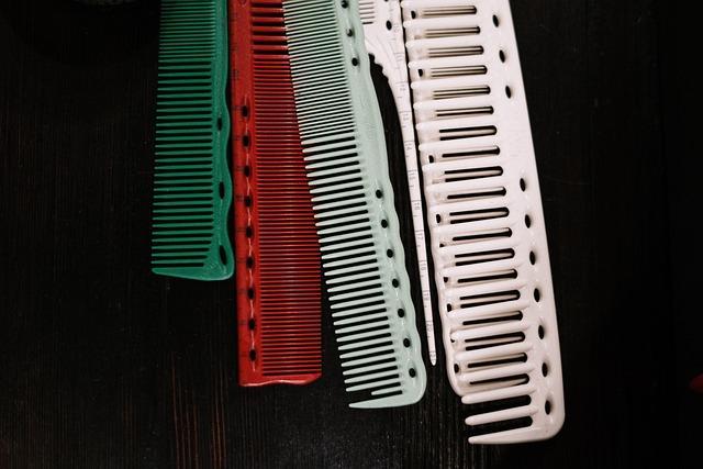 Several colored combs on a black background.