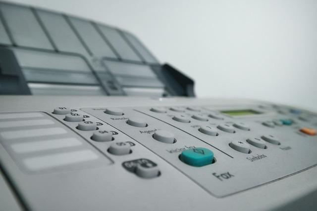 A close-up image of a fax-printer machine combo.
