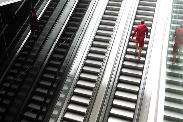 A bank of escalators and stairs in central station.