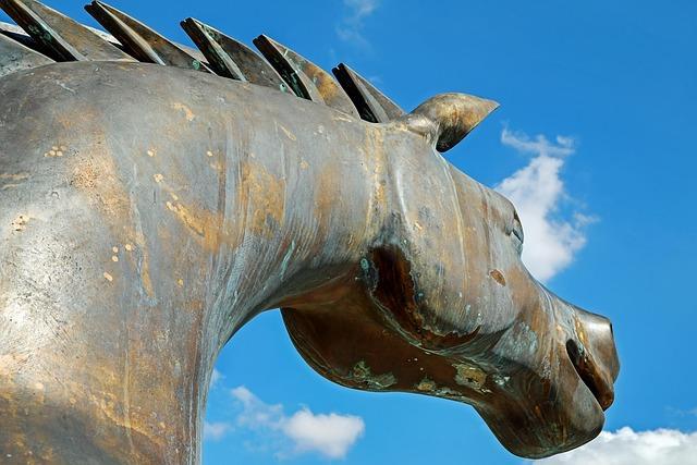 A large metal horse sculpture reminiscent of the trojan horse of old.