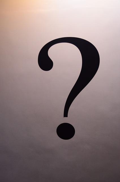 A large black question mark on a soft grey background.