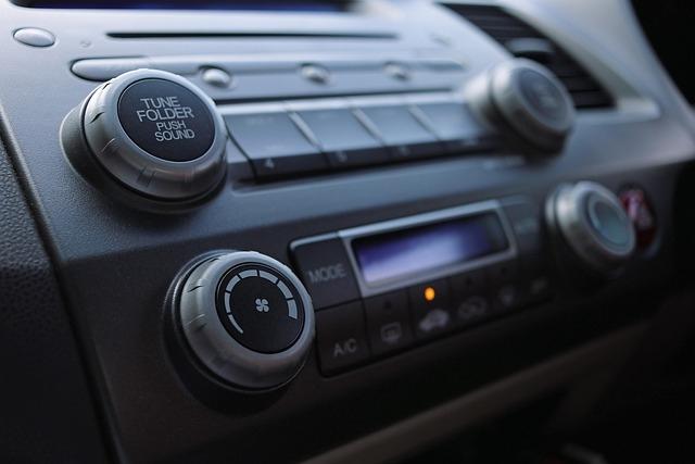 A close-up of a boom box with knobs and buttons to push.