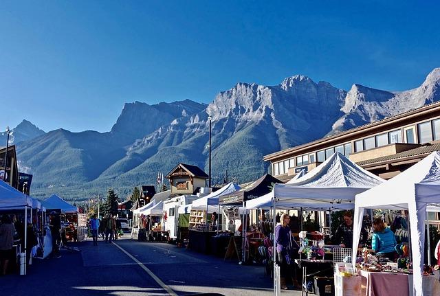 street market with mountains in the background.