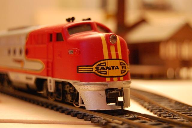 An electric Santa Fe toy train engine on a track.