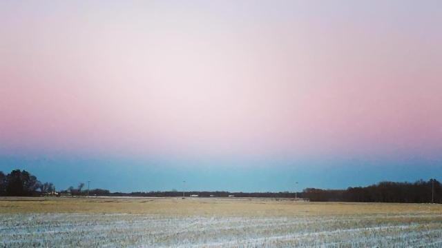 Winter sky of grey and pink in Manitoba, Canada.