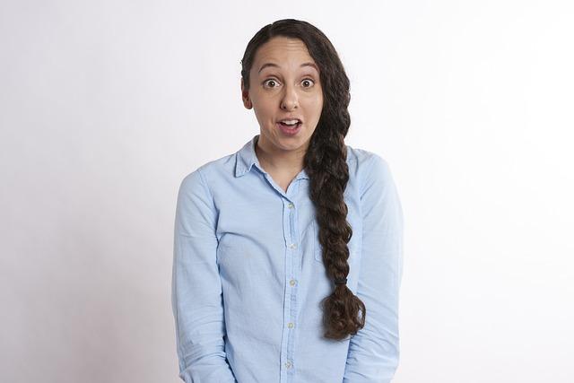 A woman looking a little surprised and anxious.