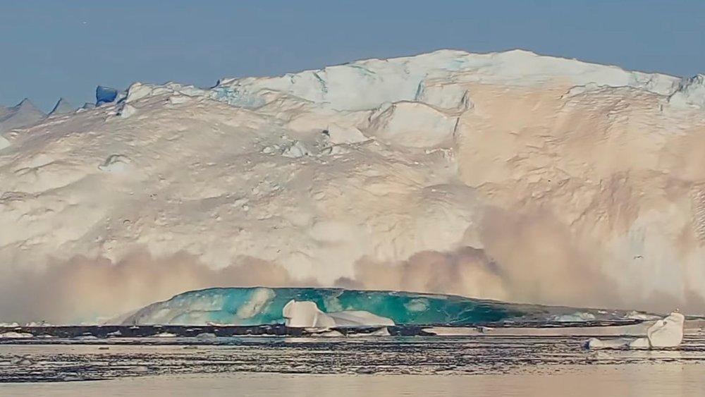 Glacier collapsing into the ocean