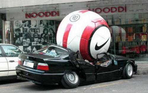 Funny Pictures of Car Crushed by Giant Soccer Ball