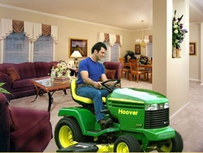 Funny Pictures of Man On Hoover Vacuum Tractor