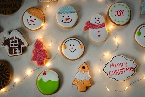 An assortment of decorated Christmas cookies spread out so each one is clearly visible.