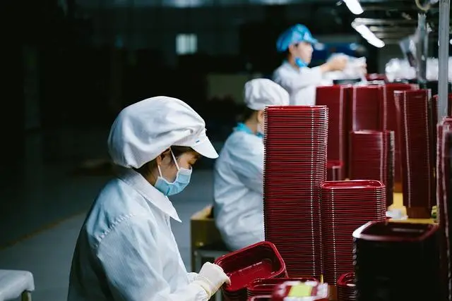 Factory workers in a production line.