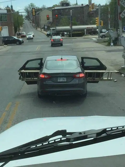 A funny car picture showing the wrong way to climb the corporate ladder A climbing the corporate ladder funny car picture