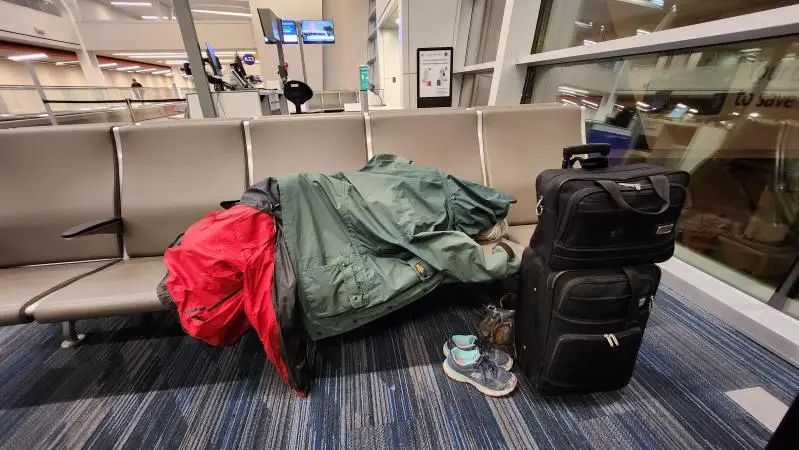 Susan sleeping in Calgary Airport