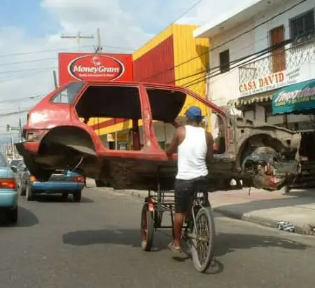 Funny Pictures of Bicycle Carrying Car Body